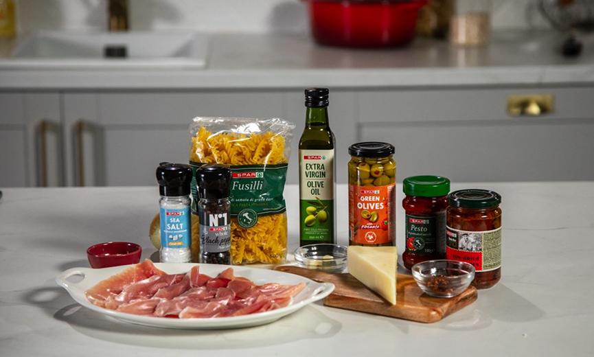 Range of Spar ingredients for Pantry Pasta on a kitchen counter.